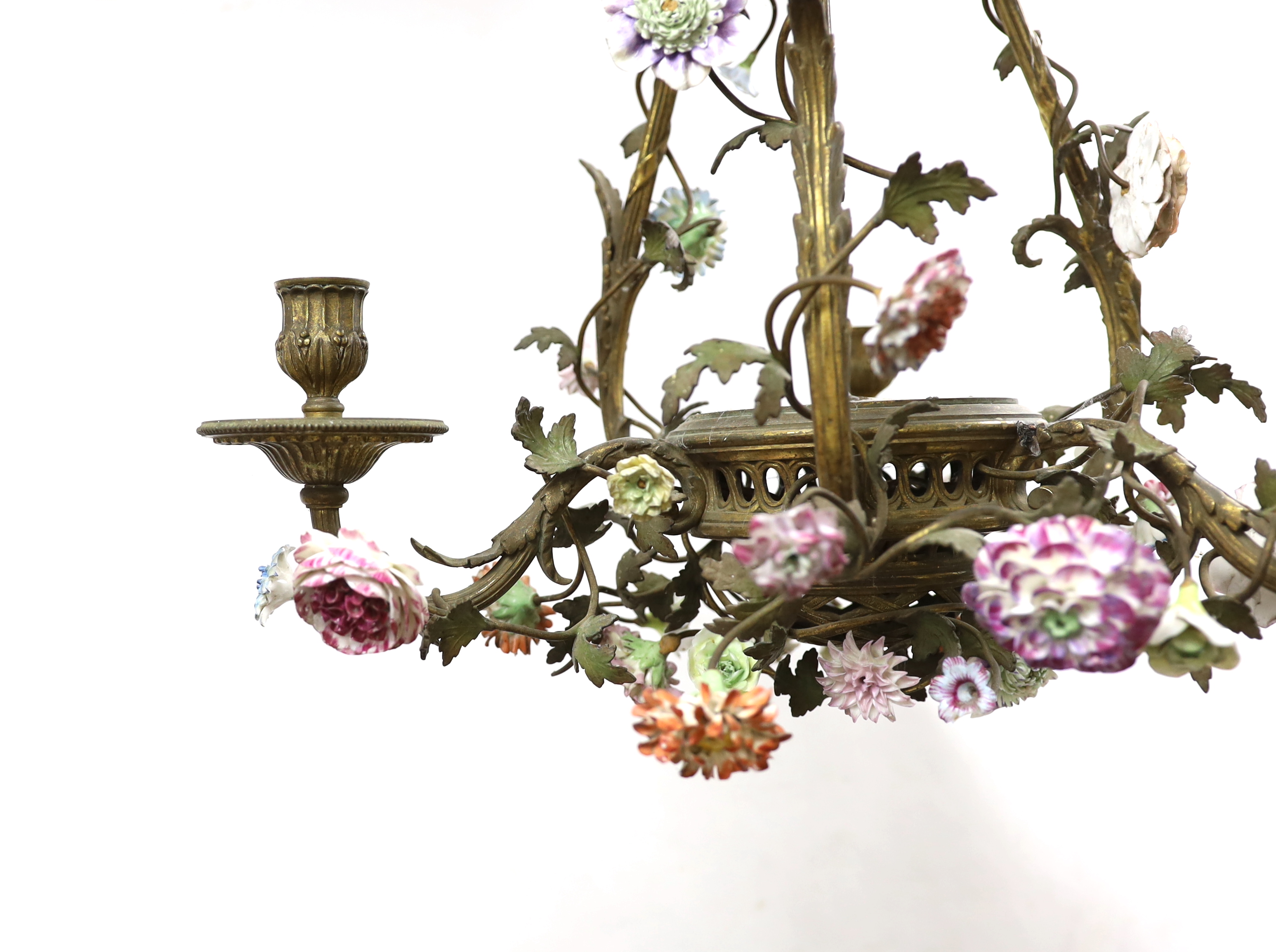 A Louis XVI style ormolu and porcelain three light chandelier Please note this lot attracts an additional import tax of 5% on the hammer price